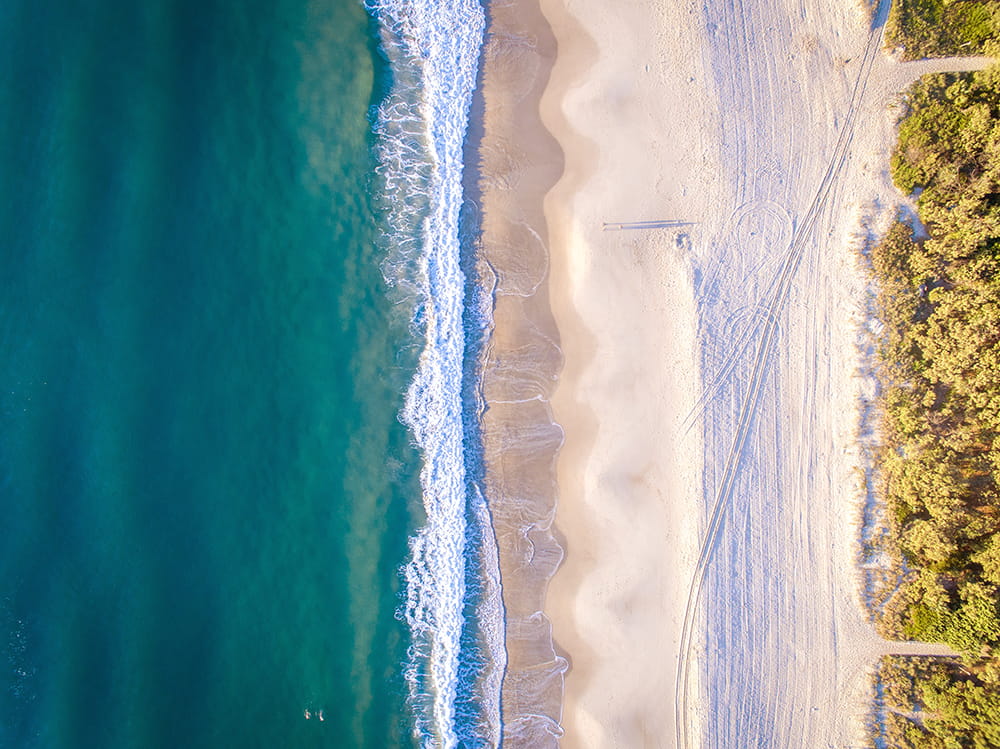 Aerial photograph of a beach and waves